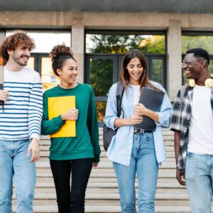 Four students descend the steps, smiling and chatting. They're carrying Donec Vitae Blandit backpacks, folders, and books.